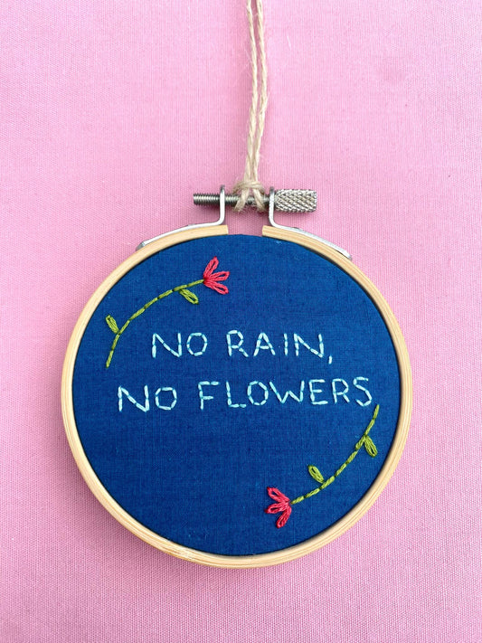 'No Rain, No Flowers' Hand Embroidered Mini Wall Hanging