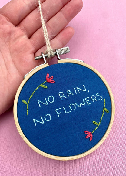 'No Rain, No Flowers' Hand Embroidered Mini Wall Hanging