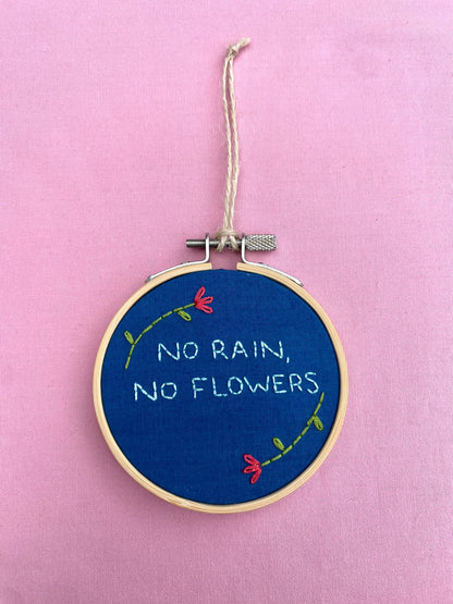 'No Rain, No Flowers' Hand Embroidered Mini Wall Hanging